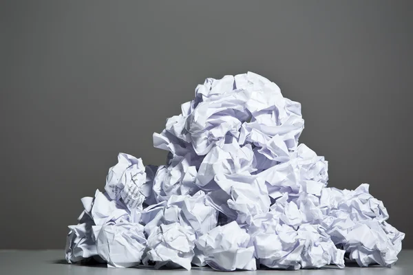 Crumpled paper on a gray background. — Stock Photo, Image