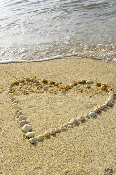 Een hart in het zand — Stockfoto