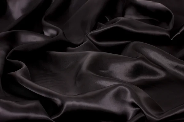 Чёрная атласная ткань — стоковое фото