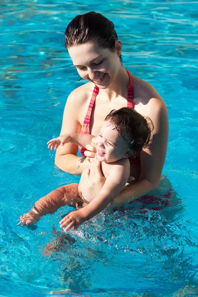 Mother with son in pool Stock Photo
