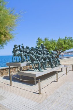 Estatua de banda de musica en L'Escala, (Costa Brava), Cataluña clipart