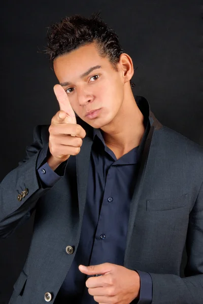 Young business man pointing at camera — Stock Photo, Image