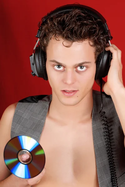 Disco jockey con auriculares y cd — Foto de Stock