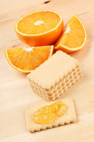 Sušenky, marmelády a oranžové — Stock fotografie