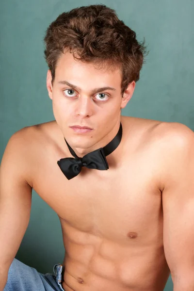 Shirtless young man with bow tie — Stock Photo, Image