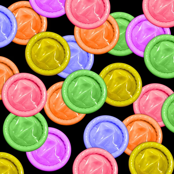 Цветные презервативы — стоковое фото