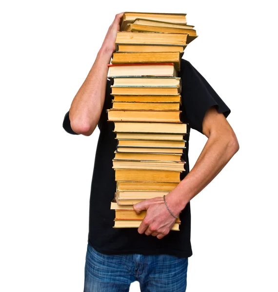 De student en zijn berg leerboeken — Stockfoto