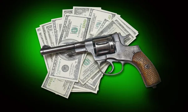 Pieniądze i broń — Zdjęcie stockowe
