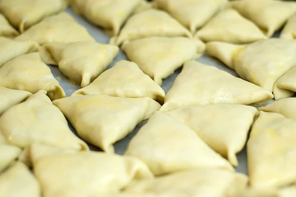 Dough with minced meat patties cooking Asian samsa — Stock Photo, Image
