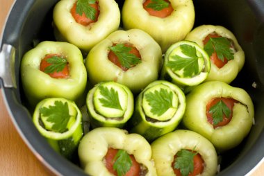 Pan with stuffed peppers and zucchini clipart