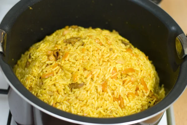 Rice, meat carrots and spices, cooking Uzbek pilaf. — Stock Photo, Image