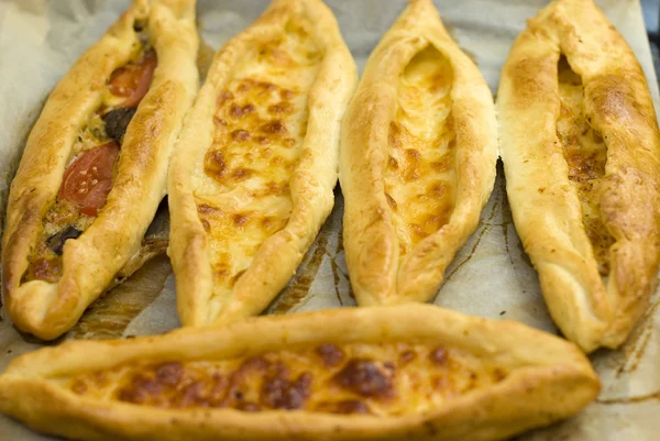 stock image Turkish food pide, yeast dough cheese and butter.