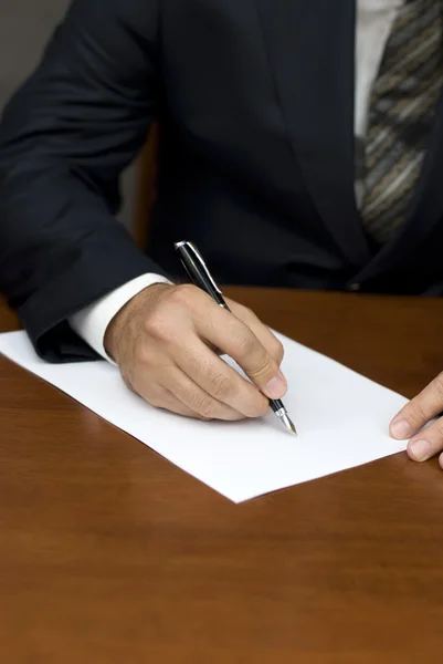 stock image Businessman's hand writing on white sheets