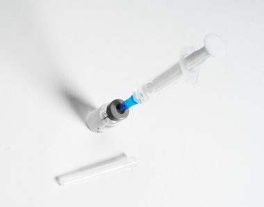 Syringe and glass vial clipart