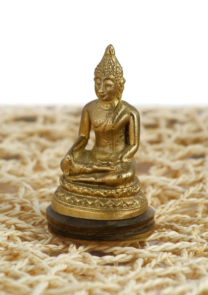 Bronzen Boeddha in een lotus positie op de mat — Stockfoto