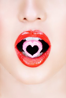 Heart candy in red lips..Heart candy in red lips.