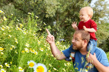 Father and son in flowers clipart