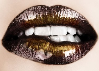 Black gold lips biting. clipart