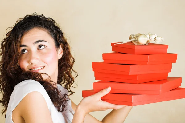 Happy woman with red gifts — Stock Photo, Image