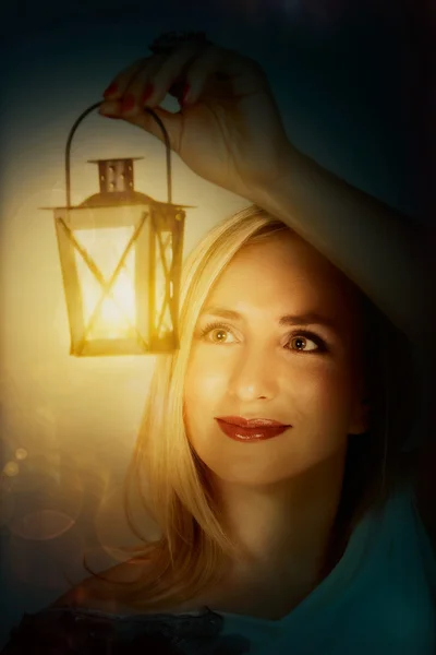 Woman with light lantern — Stock Photo, Image