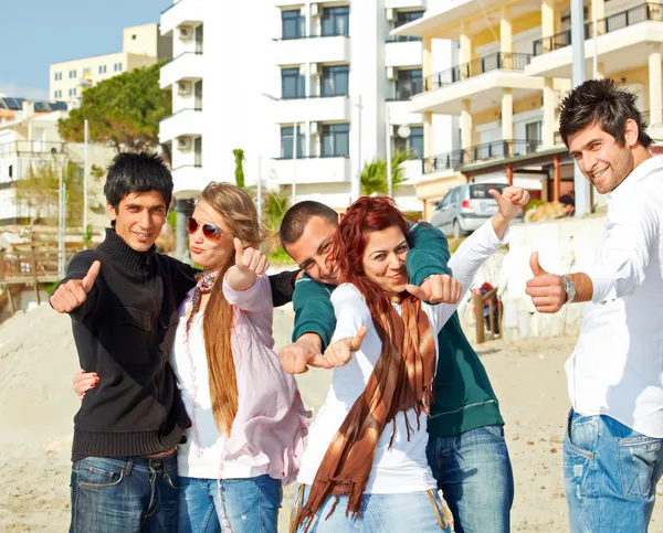 Turkish students showing thumbs up on the beach . — Stock Photo, Image
