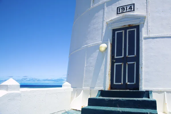 Lighthouse entrance against blue sky — Stock Photo, Image