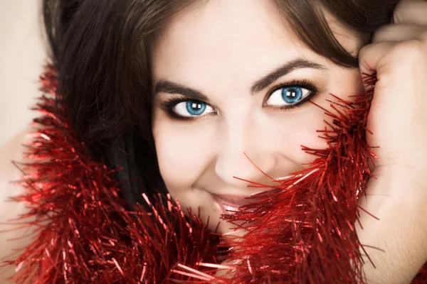 Beautiful brunette woman with tinsel — Stock Photo, Image