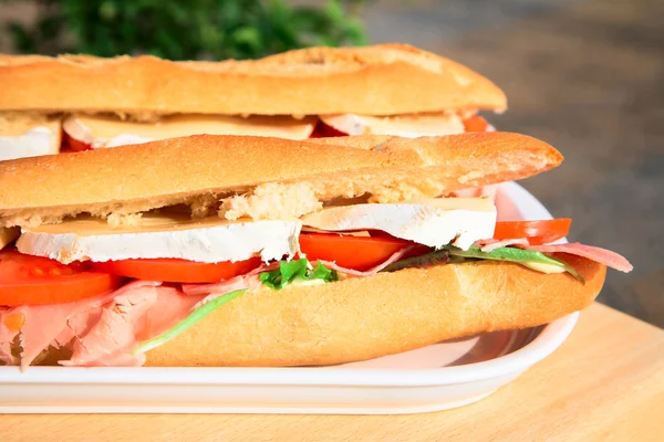 stock image Baguette with cheese and ham