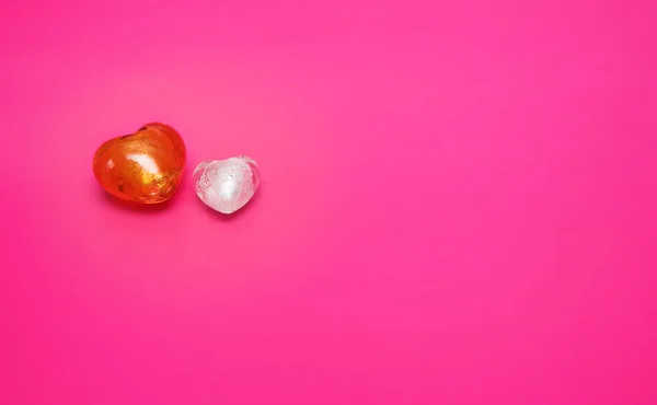 stock image Glass hearts on pink