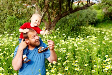 Father and son in flowers clipart