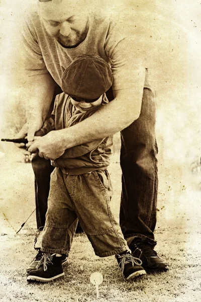Father and son play golf. — Stock Photo, Image