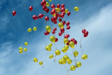 Balloons in blue sky clipart