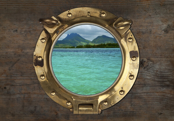 Antique Porthole with Tropical View on a wooden Wall Background.