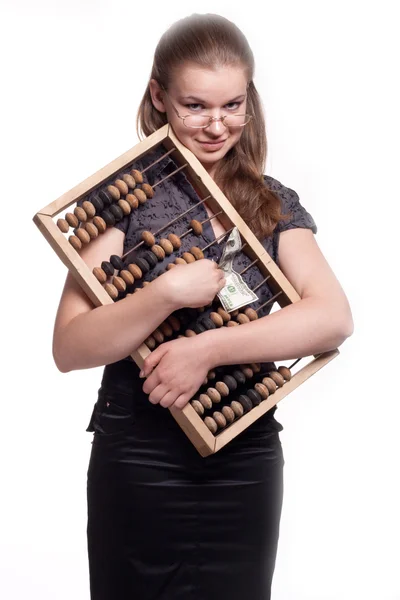 Meisje met grote houten accounts en geld — Stockfoto