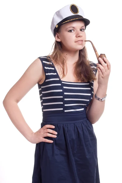 Girl in a sailor cap smoking a pipe — Stock Photo, Image