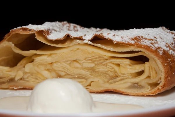 Stock image Apple pie with powdered sugar and ice cream at the forefront