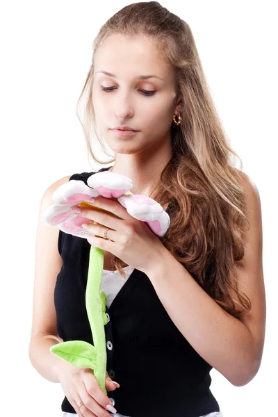 Flicka med en leksak blommans färg — Stockfoto