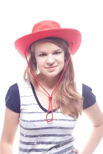 Porträtt av en flicka i en röd hatt — Stockfoto