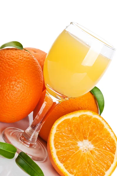 Orange juice in glass and fruits — Stock Photo, Image