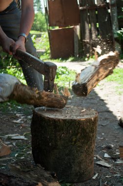 Man chopping firewood clipart