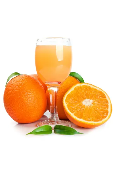 Orange juice in glass and fruits — Stock Photo, Image