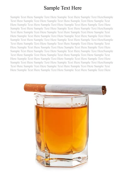 Glass of cognac and cigarettes — Stock Photo, Image