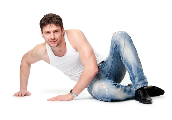 L'uomo in jeans è su uno sfondo isolato — Foto Stock