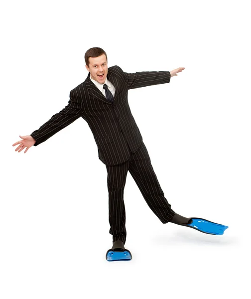 Человек в деловом костюме и ласты для плавания — стоковое фото