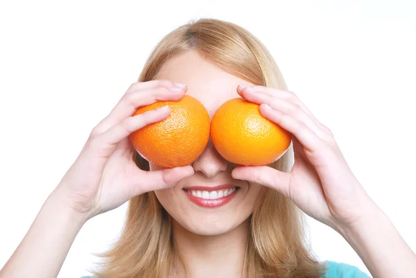 Flickan och två apelsiner — Stockfoto