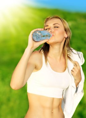 Healthy woman drinks water clipart