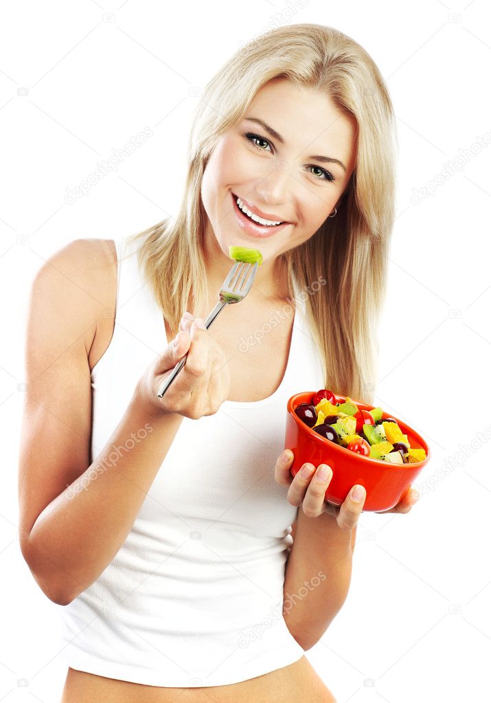 Pretty girl eating fruits