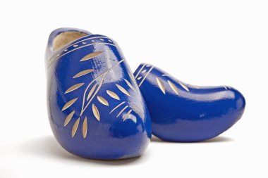 Pair of traditional dutch wooden shoes clipart