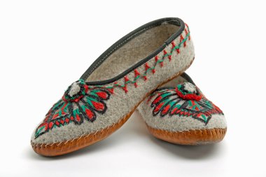 Polish mountaineers wear such traditional slippers clipart