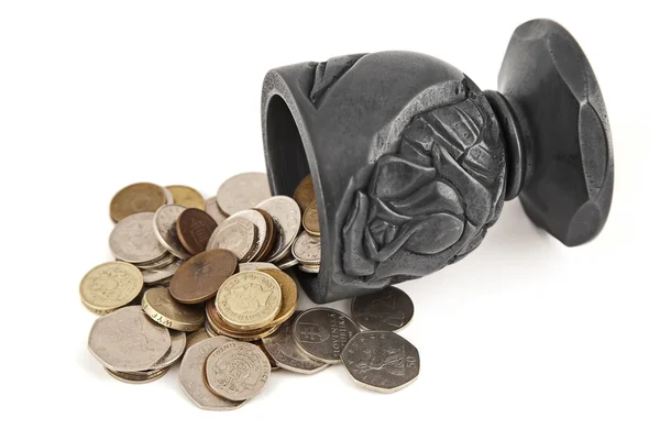 stock image Coins spilling a cup of coal